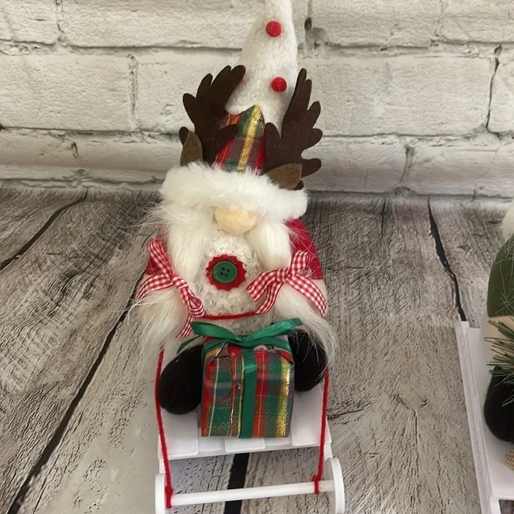 NIB! Two Christmas gnome figures on sleds